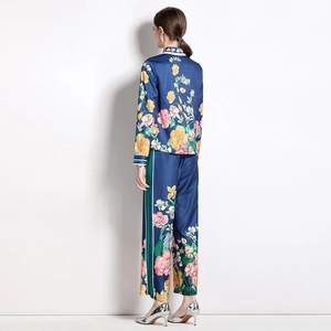 Women floral print satin two-piece set featuring long sleeve shirt and wide leg pants
