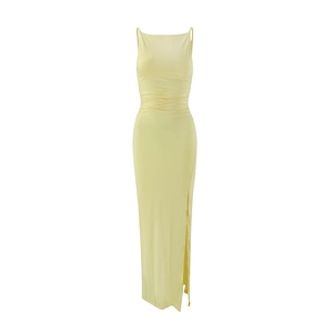 Detail of light yellow ruched maxi dress with side slit and spaghetti straps