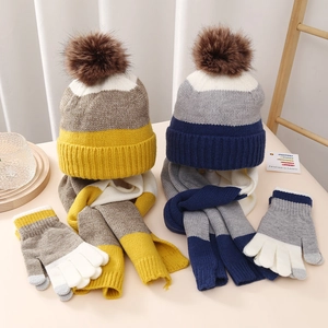 Winter kids knit set with pom-pom beanie scarf and touchscreen gloves in color blocks