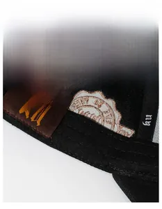 Detail of baseball cap interior showing moisture-wicking sweatband and inner stitching