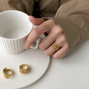 Minimalist gold multi-layered entwined rings for women with spiral textured design