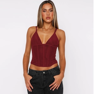 Detailed view of dark red corset camisole featuring boning structure and ruched velvet fabric