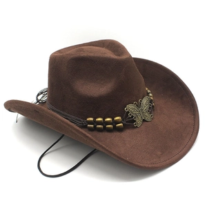 Detail of dark brown suede cowboy hat with bronze butterfly pendant and braided band