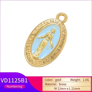Gold plated brass oval Virgin Mary pendant with light blue enamel and religious engraving