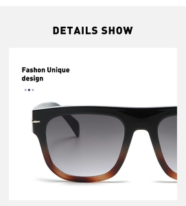 Detail show of oversized gradient sunglasses with silver accents and gray lenses