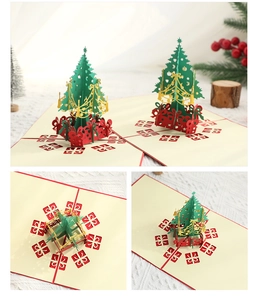 Detail view of a 3D pop-up Christmas card featuring a green tree and red base