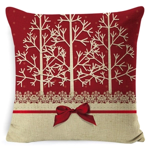Christmas pillow cover with white tree silhouettes, snowflakes and red bow decoration