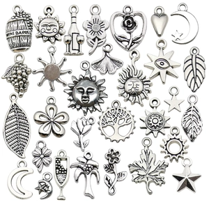 Vintage silver alloy charms set featuring star moon sun and floral leaf designs