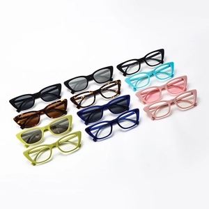 Fashionable cat eye sunglasses and frames in multiple colors on white background