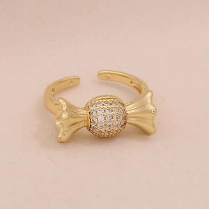 Macro detail of gold candy-shaped ring with pavé cubic zirconia setting