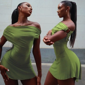 Detail of olive green off-shoulder mini dress with metallic ring accents and slim fit cut