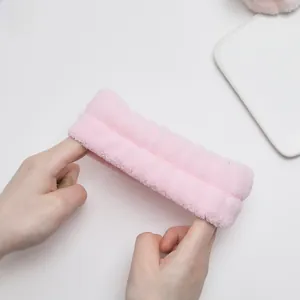 Pink coral fleece headband for skincare showing high elasticity and soft plush texture