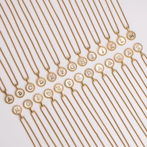 Golden stainless steel round alphabet shell necklaces showing 26 initial pendants