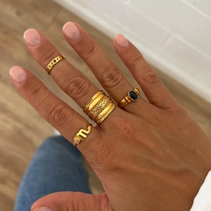 Set of four 18K gold plated zodiac rings with black agate and pink zircon stones