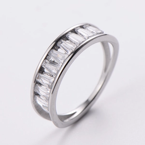 Detailed view of silver ring featuring channel-set baguette-cut sparkling crystals