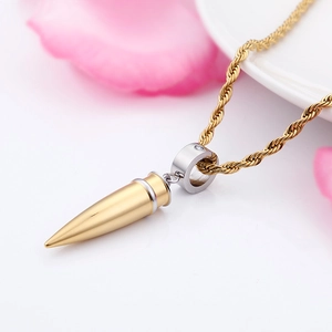 Street style gold bullet pendant necklace with silver accents on a twisted rope chain