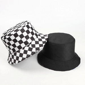 Checkered and black reversible bucket hats displayed on a clean white background