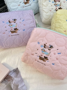 Quilted makeup bags with dachshund embroidery and 'Have a nice day' text in various colors