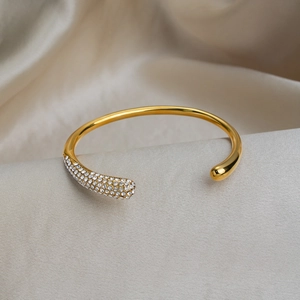 Luxurious 18K gold plated stainless steel cuff bracelet with sparkling crystal accents