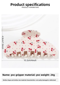 Detail of cream PVC hair claw clip with cherry patterns and precise dimensions 10.2cm