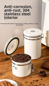 Detail view of white stainless steel coffee canisters with vacuum seal and date tracker