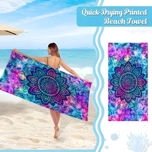 Detail of quick-drying microfiber beach towel featuring blue mandala starry sky print
