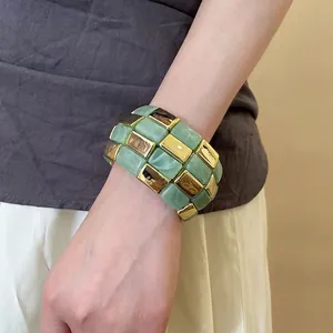 Acrylic geometric bangle with green marble resin and golden metal cubes for women