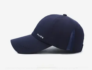 Detail of navy baseball cap featuring breathable laser-cut holes and RUIEE side logo