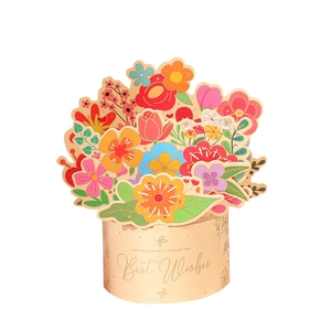 Detail of 3D pop-up flower bouquet card with golden Best Wishes text on beige pot