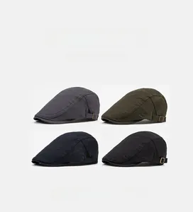 Detail of adjustable metal buckles and textured fabric on stylish British newsboy caps