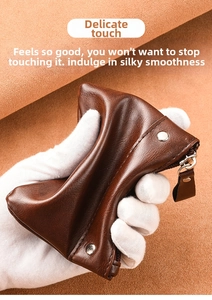 Close-up of soft brown PU leather coin purse showing flexible texture and metal rivets
