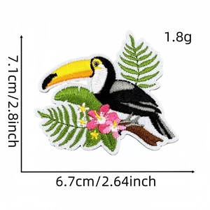 Detailed view of tropical toucan embroidered patch with exact size measurements in inches