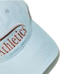 Detailed close-up of blue cotton baseball cap with 3D Athletics embroidery and stitching