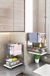 Detail of dark grey kitchen sink organizer with cloth rail and removable drain tray