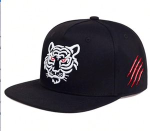 Detailed view of white tiger embroidery and red claw marks on black hip hop cap