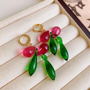 Elegant cherry-shaped drop earrings with pink crystal and green leaves in gold