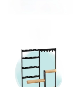 Detail of jewelry organizer featuring black metal frame and dual wood tiers for earrings