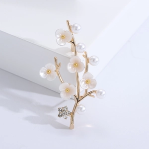 Elegant gold plum blossom brooch with white flowers, pearls and sparkling rhinestones