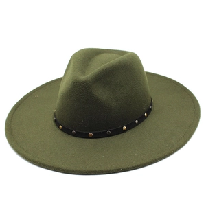 Macro detail of olive green wool fedora hat with wide brim and studded black decorative band