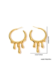 Detail of gold lava teardrop earrings showing dimensions 6x3.5cm and polished finish