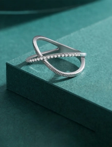 Macro view of S925 silver crossover ring with fine micro-set zircon geometric lines