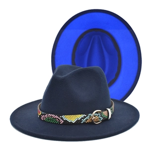 Detail of navy blue felt fedora with vibrant blue brim interior and snakeskin band decoration