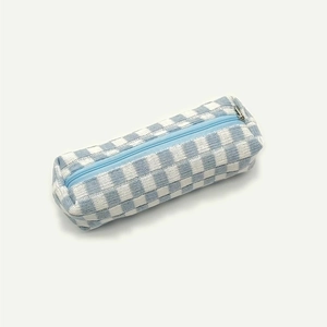 Detailed view of light blue and white checkerboard knit pencil case with zipper