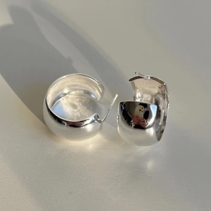 Minimalist 925 sterling silver C-shaped thick hoop earrings on a neutral background