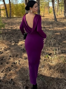 Detail of elegant backless design and draped neckline on a slim fit long sleeve dress