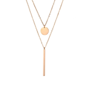 Close-up of double-layered rose gold stainless steel necklace with round and bar pendants