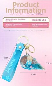 Detail of blue liquid sand bear keychain with silicone strap and floating glitter charms