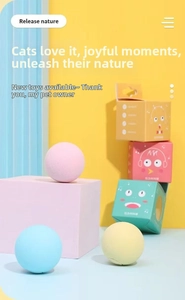 Three colorful interactive squeaky cat toy balls with matching cartoon gift boxes