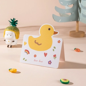Cute yellow duck cartoon folding greeting card with love love text on textured paper