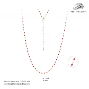 Detail view of 925 sterling silver gold necklace with red beads and size measurements